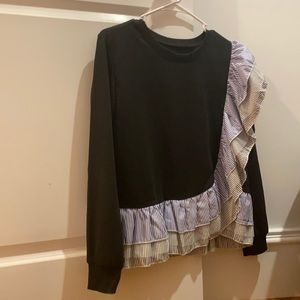 super cute black ruffled top.